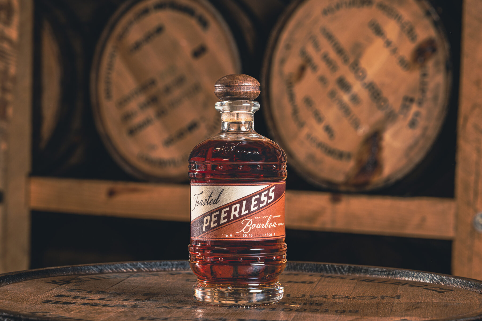 Kentucky Peerless Toasted Bourbon bottle on a barrel head in the rickhouse, photographed by Shaun Wilson