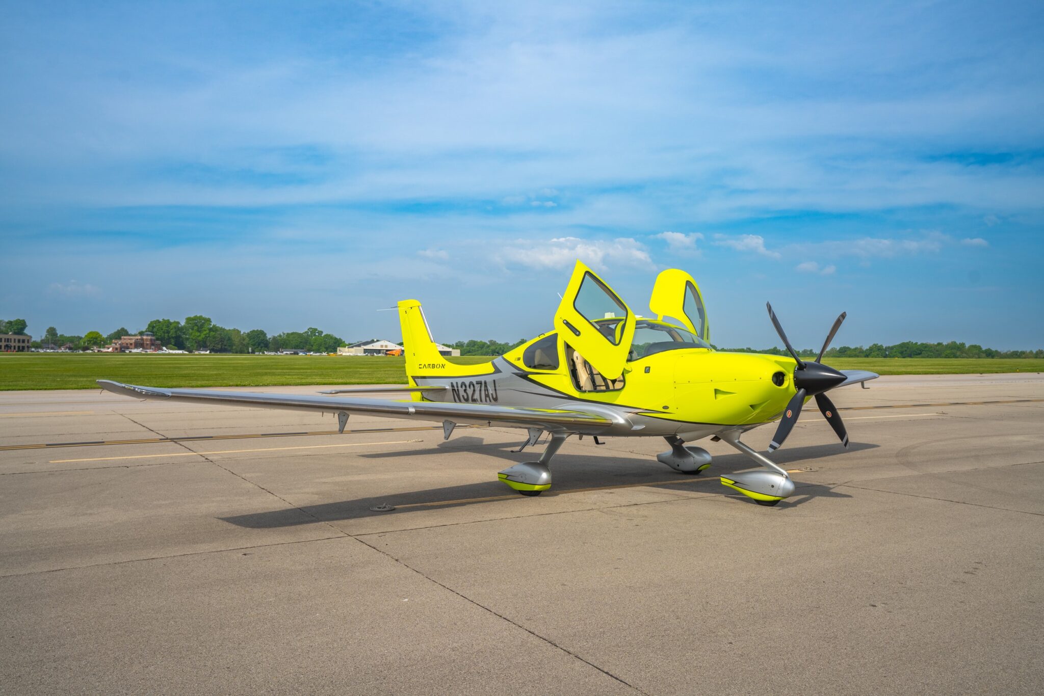 Yellow Cirrus SR22 on the ramp at Bowman Field Louisville