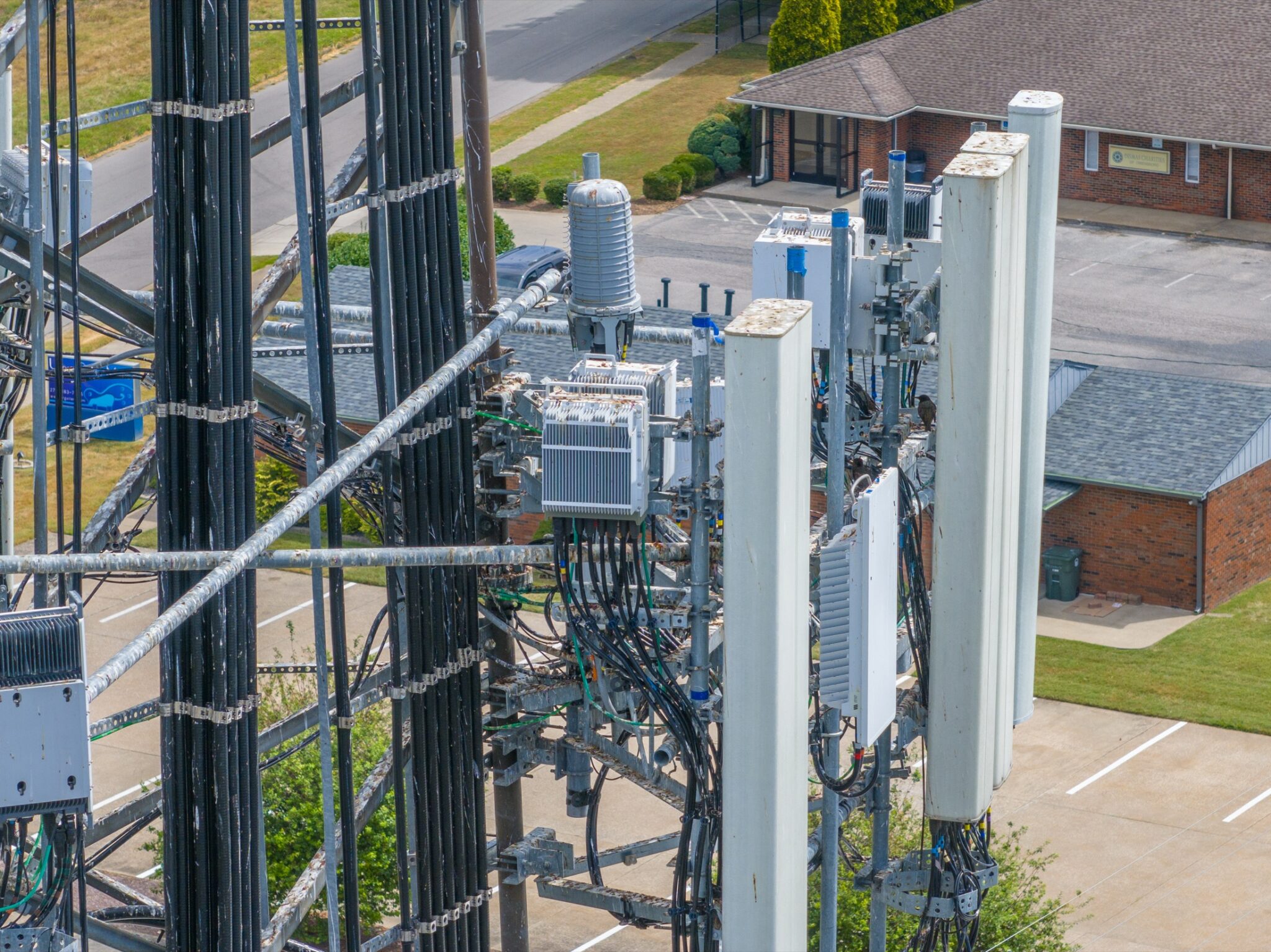 Detailed drone photo of cell tower mounts and cabling captured during an inspection