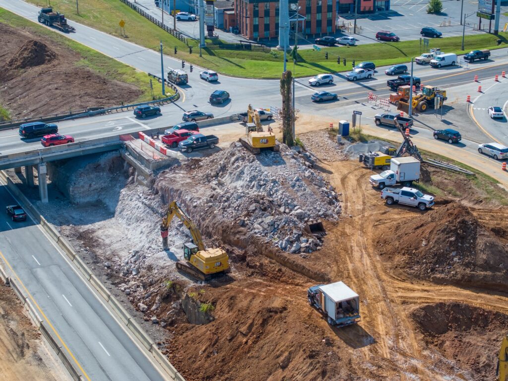 Aerial photograph of a Kentucky commercial construction site showing the full building footprint and site access