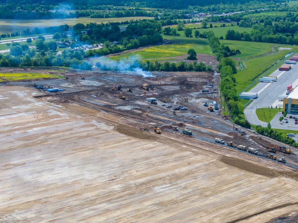 Aerial view of a Central Kentucky commercial construction site with surrounding roads and parcels visible