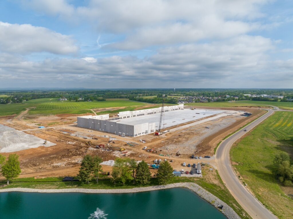 Aerial photograph of a Southern Indiana construction site with the surrounding road network visible