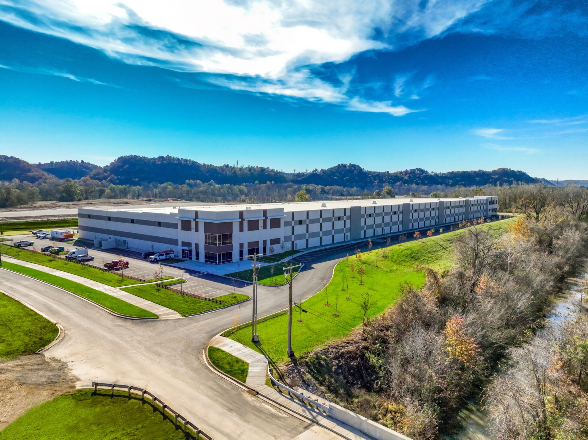Aerial construction progress photograph of a completed industrial warehouse facility