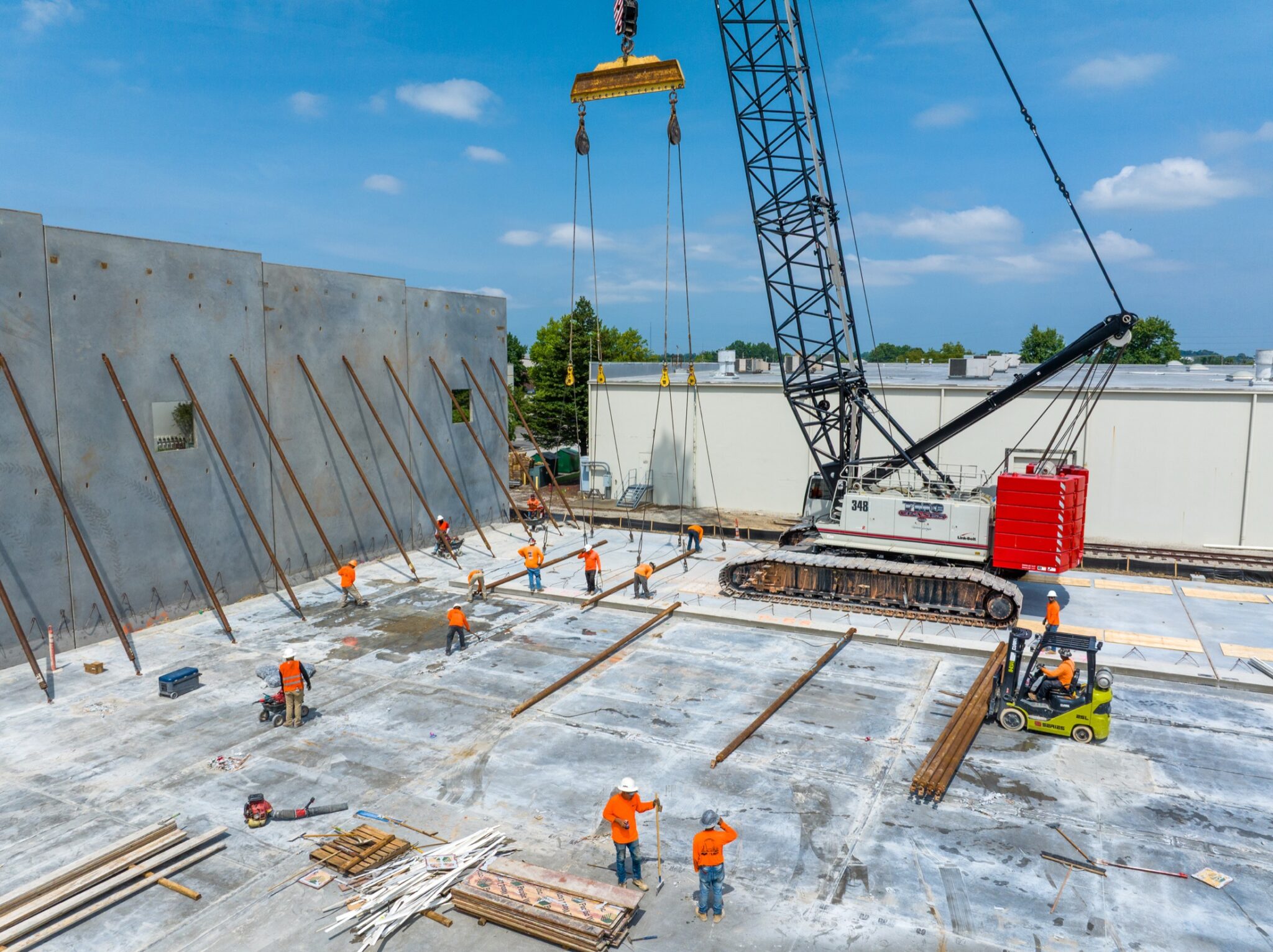 Aerial video still showing construction progress across a large commercial site