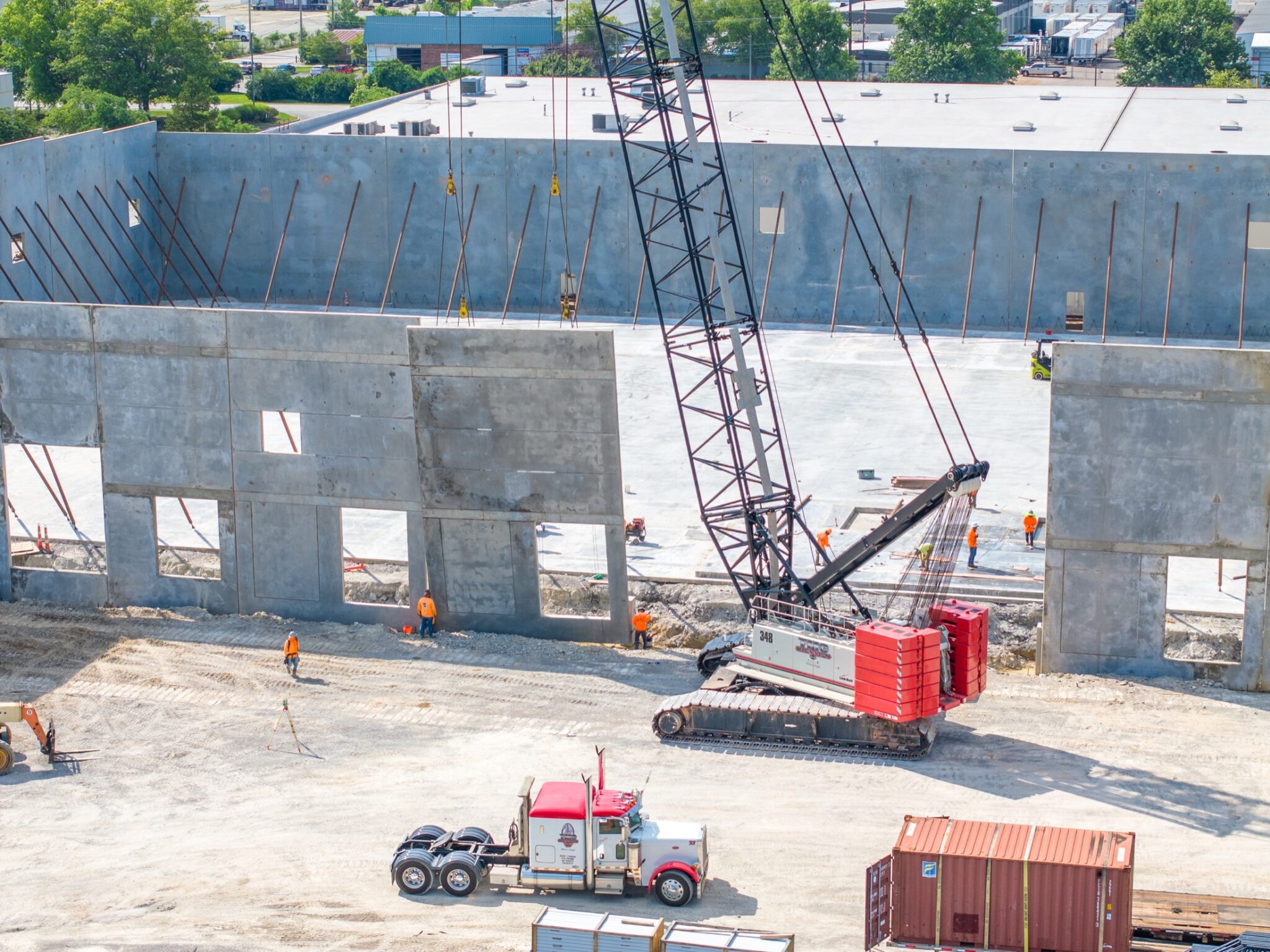 Aerial frame from a construction progress video flight over an active site
