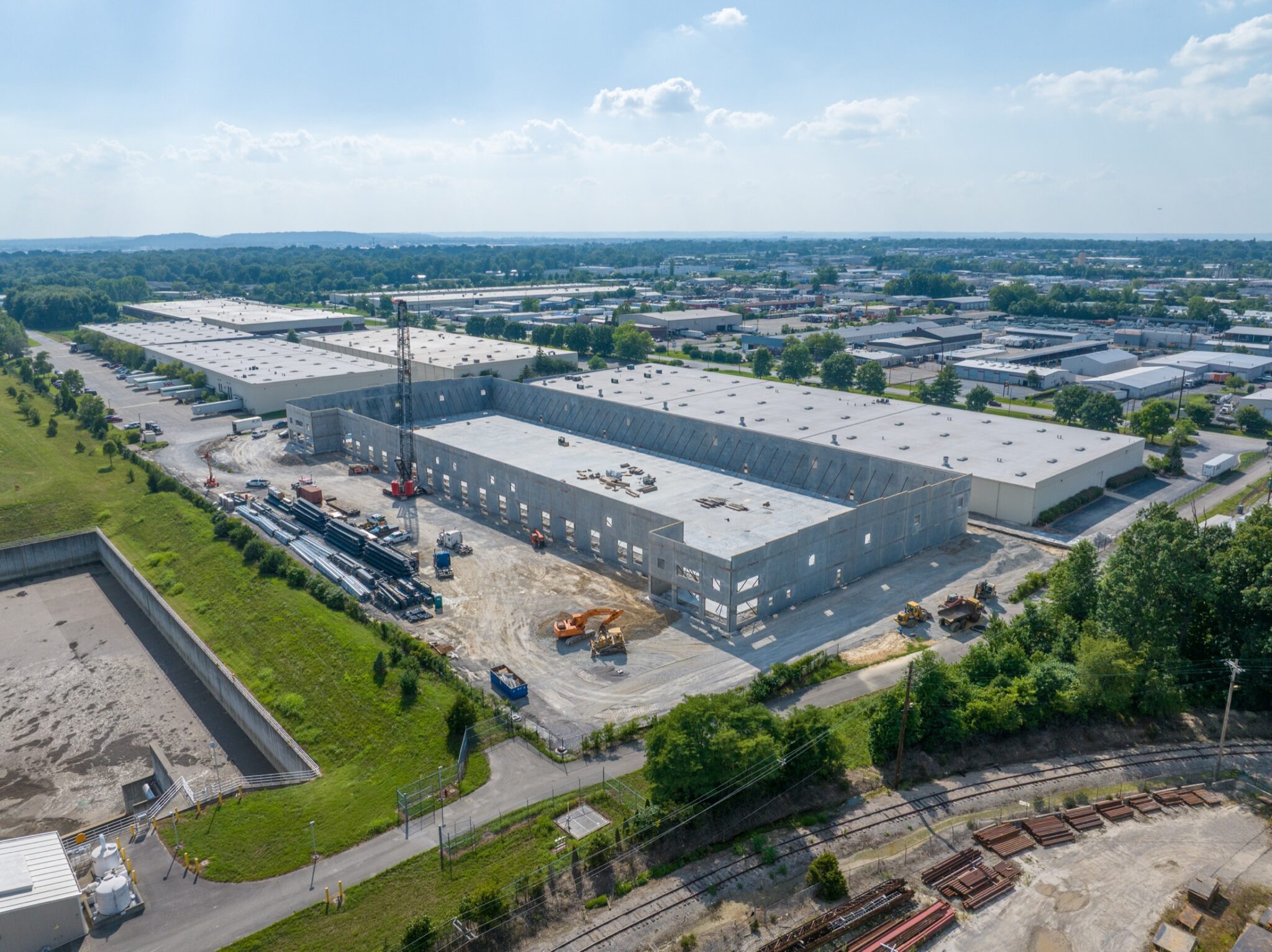 Aerial view of an industrial construction site documented for monthly progress video