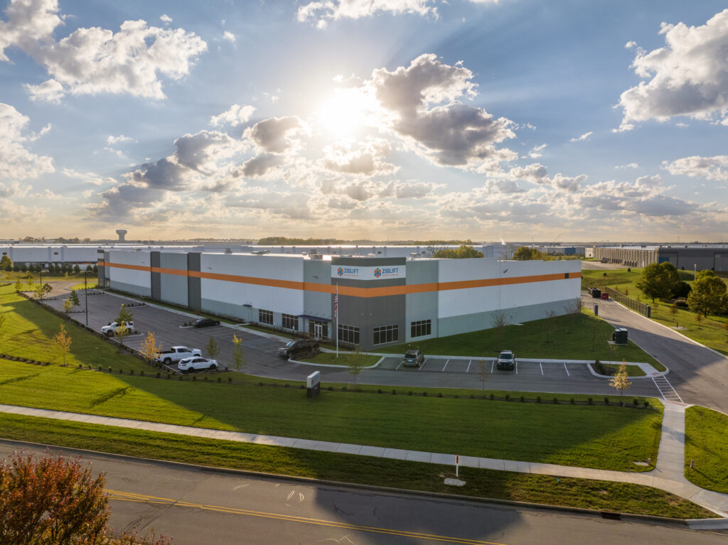 Aerial view of a commercial building in Jeffersonville, Indiana showing the site, parking, and road access