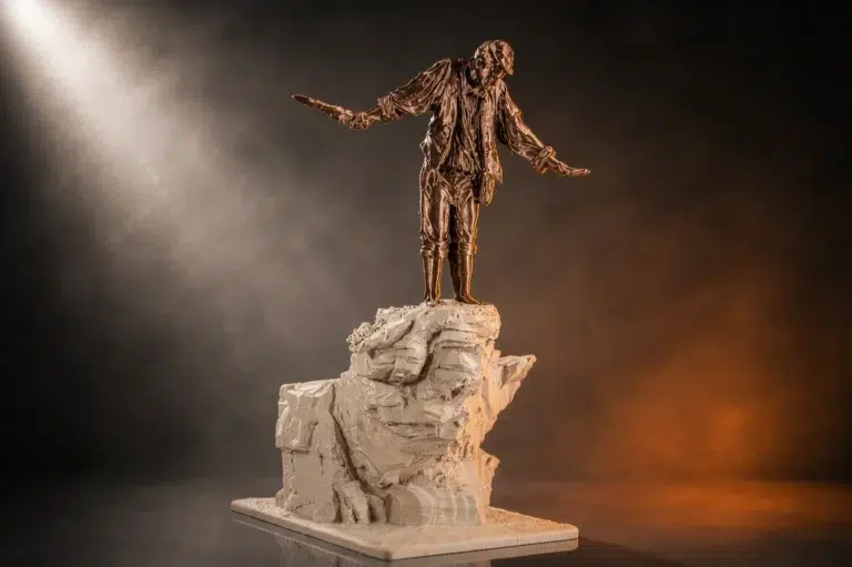 Limited edition 3D printed cliffside figure mounted on a monolith base