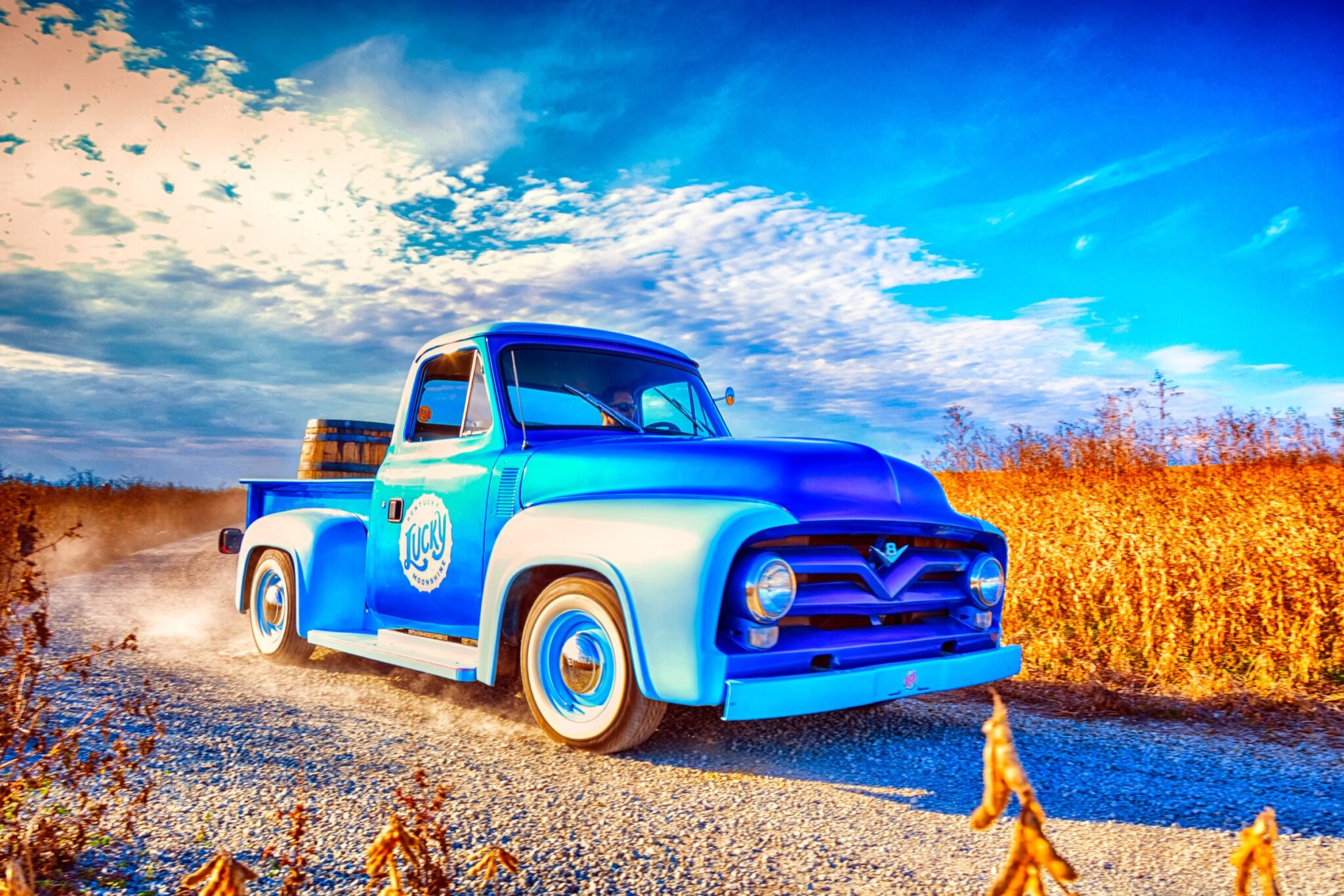 Vintage Lucky Moonshine pickup truck on a Kentucky gravel road - brand campaign photography