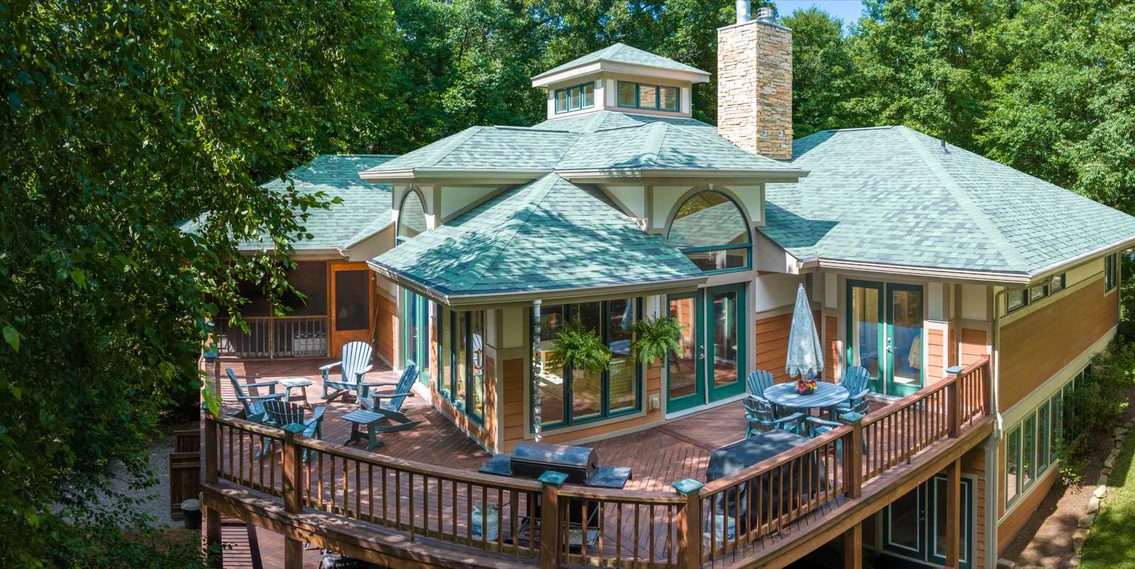 Aerial drone photograph of a luxury lakefront home