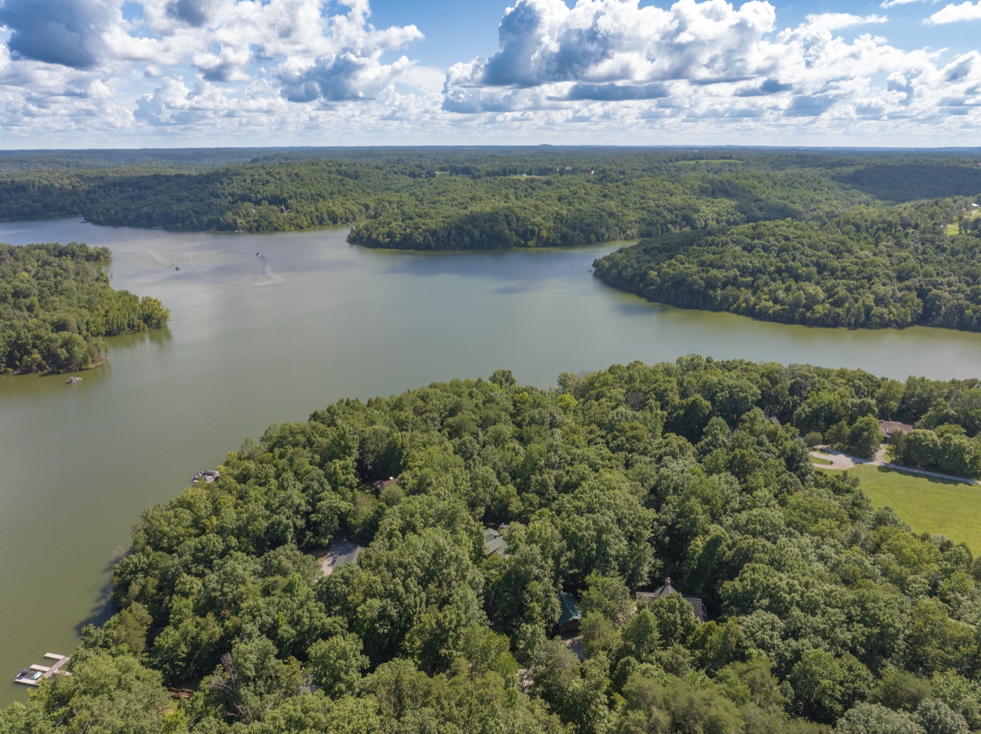 Aerial view of the lake surrounding a luxury property, drone real estate photography