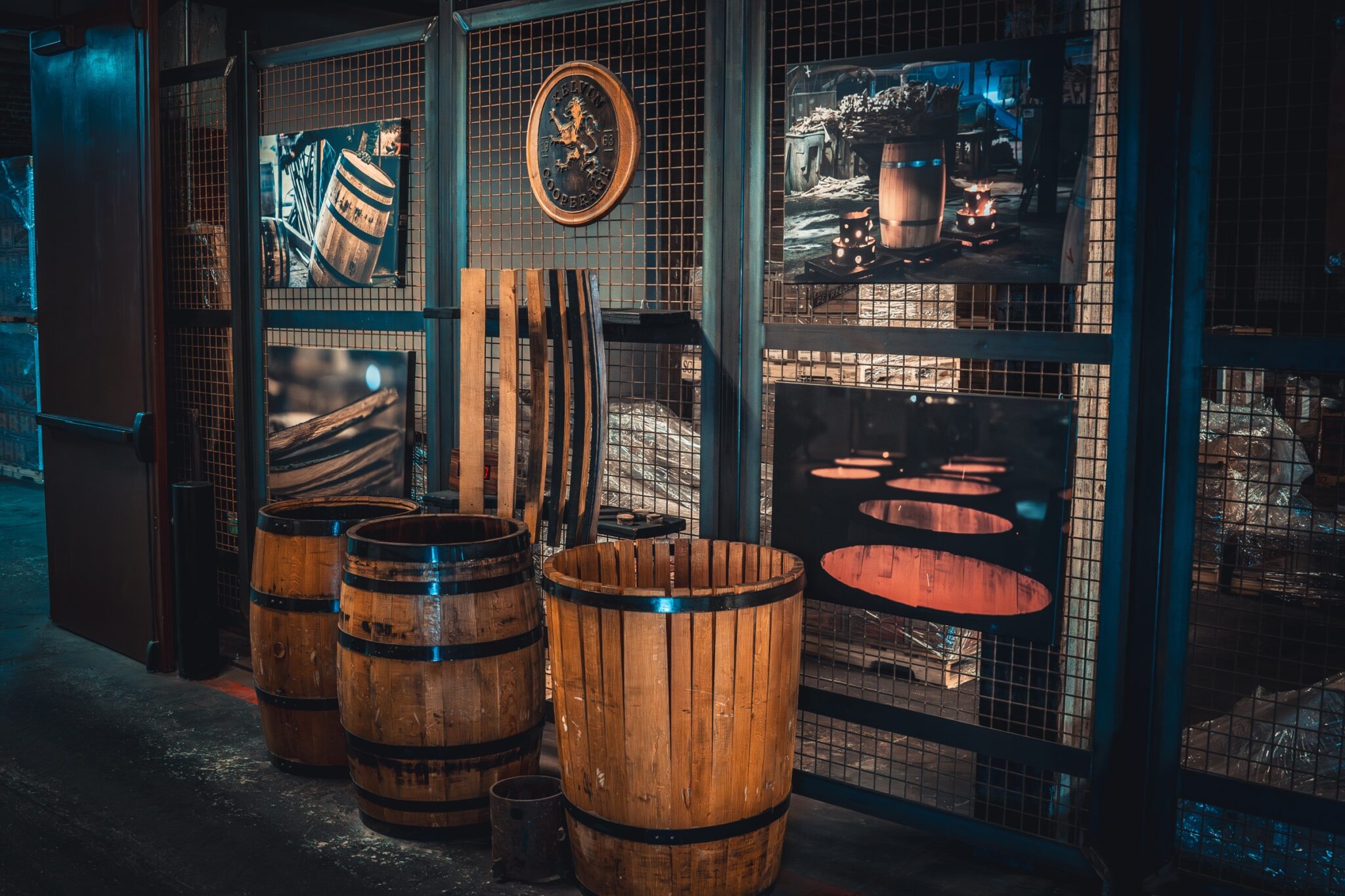 Charred bourbon barrels and cooperage display at Kentucky Peerless Distilling Co.