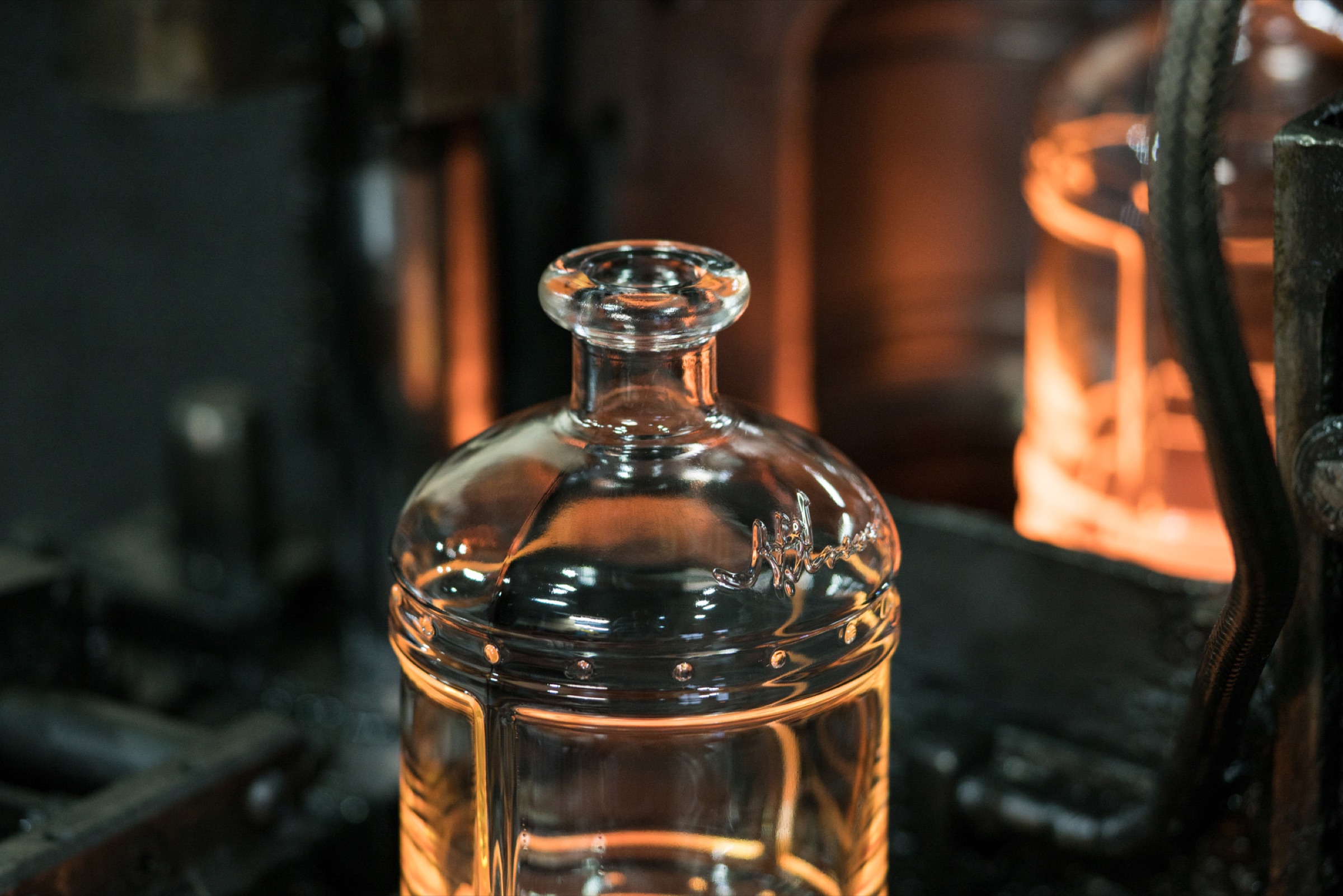 Kentucky Peerless bottles on the production line, industrial photography by Shaun Wilson