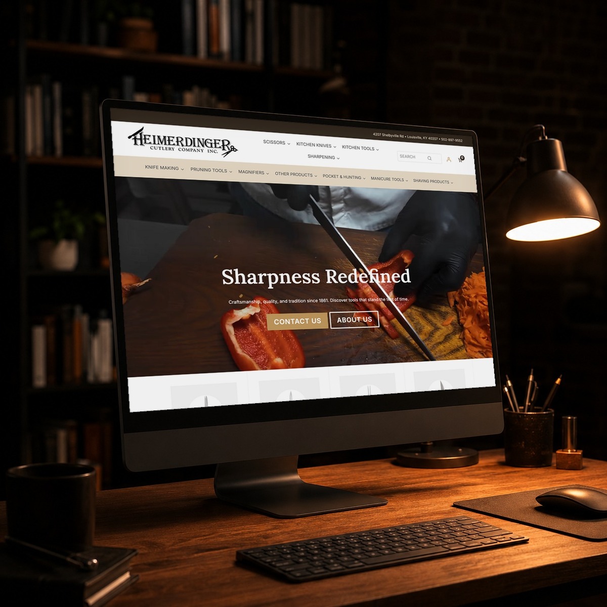 Heimerdinger Cutlery website on a desktop monitor in a dark studio, WordPress development by Shaun Wilson Designs in Louisville