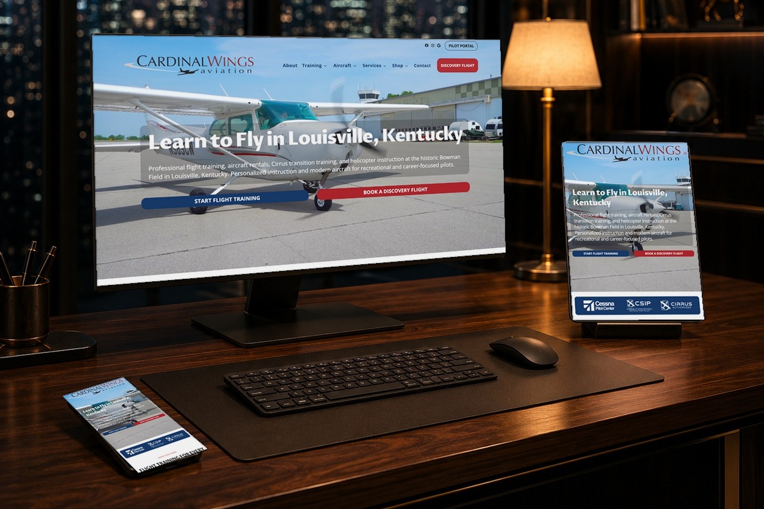 Laptop and smartphone showing the same modern website design with consistent branding