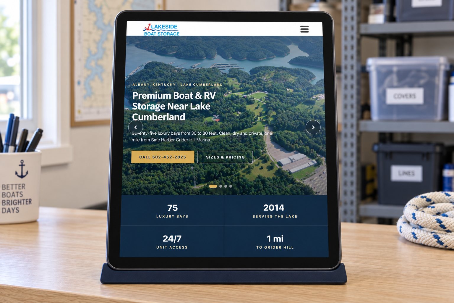 The Lakeside Boat Storage homepage on a tablet on an office counter, a presentation scene built from the real site.
