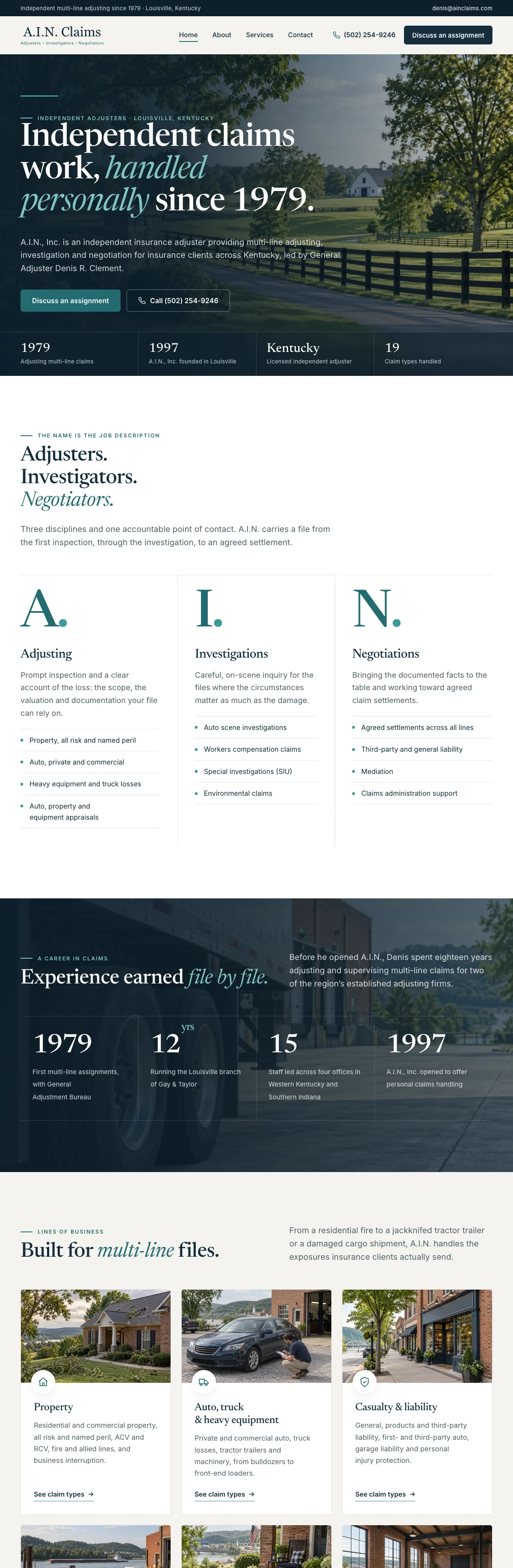 The A.I.N. Claims website on a desk monitor